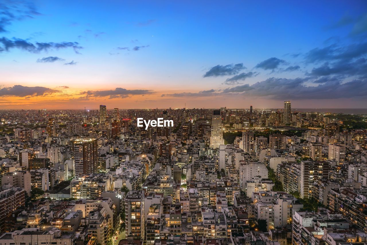 High angle view of city against sky during sunset