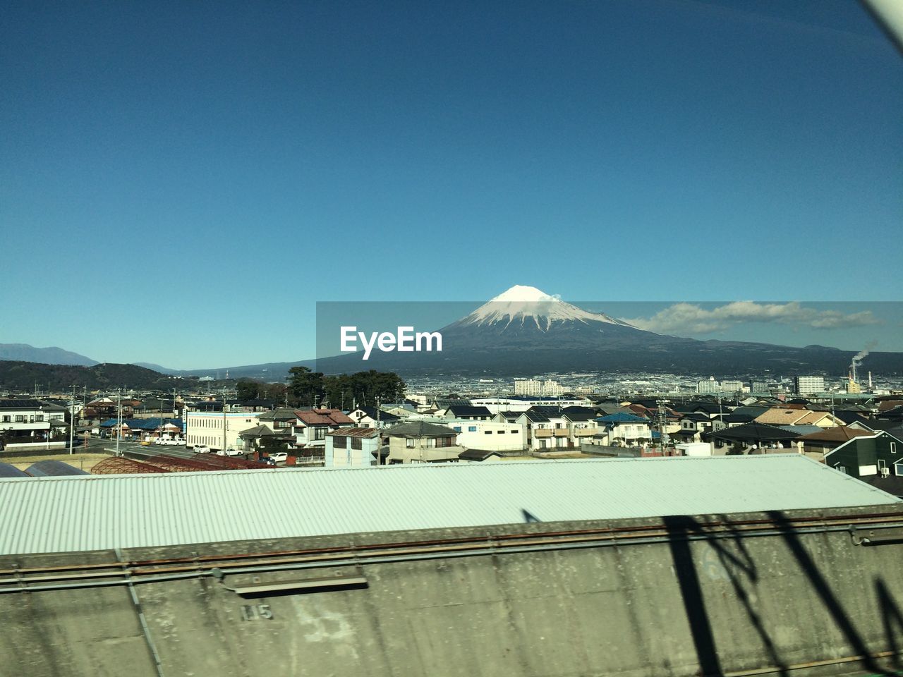 Cityscape with volcanic mountain background