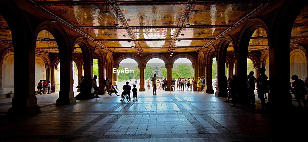 VIEW OF PEOPLE IN CORRIDOR OF CATHEDRAL