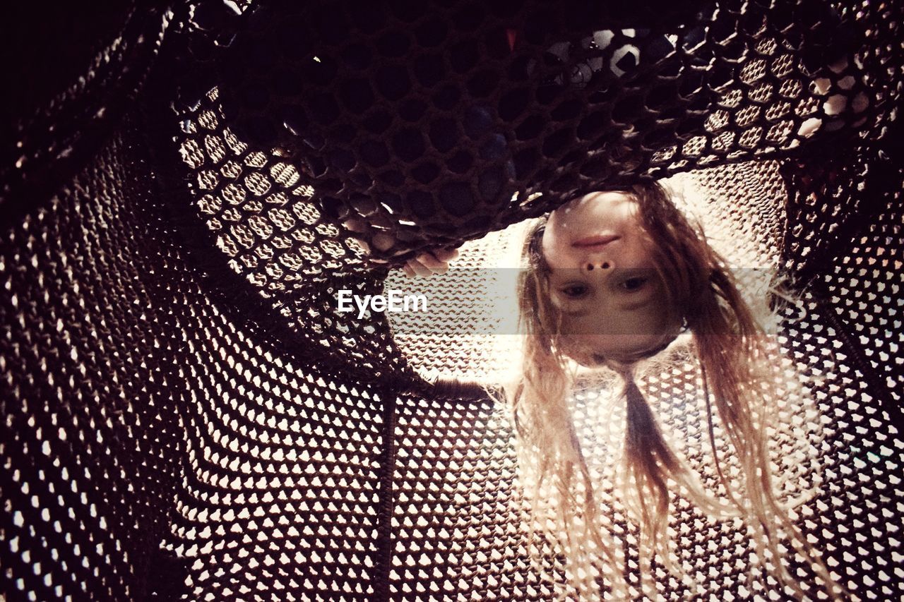 Portrait of girl playing in jungle gym