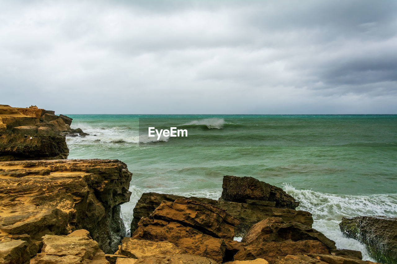 SCENIC VIEW OF SEA AND ROCKS