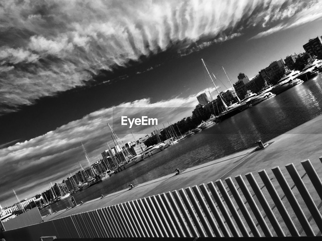 VIEW OF CITY AGAINST CLOUDY SKY