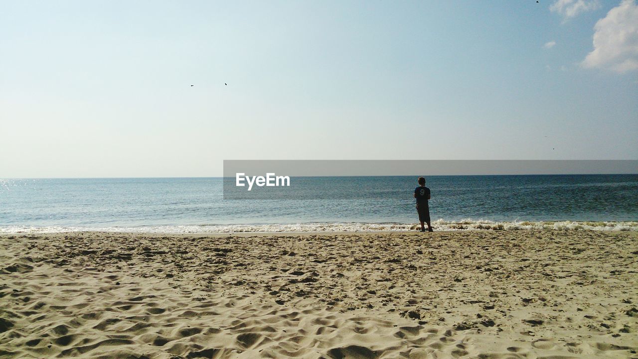 SCENIC VIEW OF BEACH AGAINST CLEAR SKY