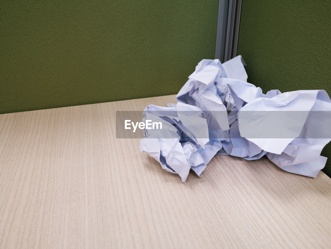 Crumpled papers on wooden table