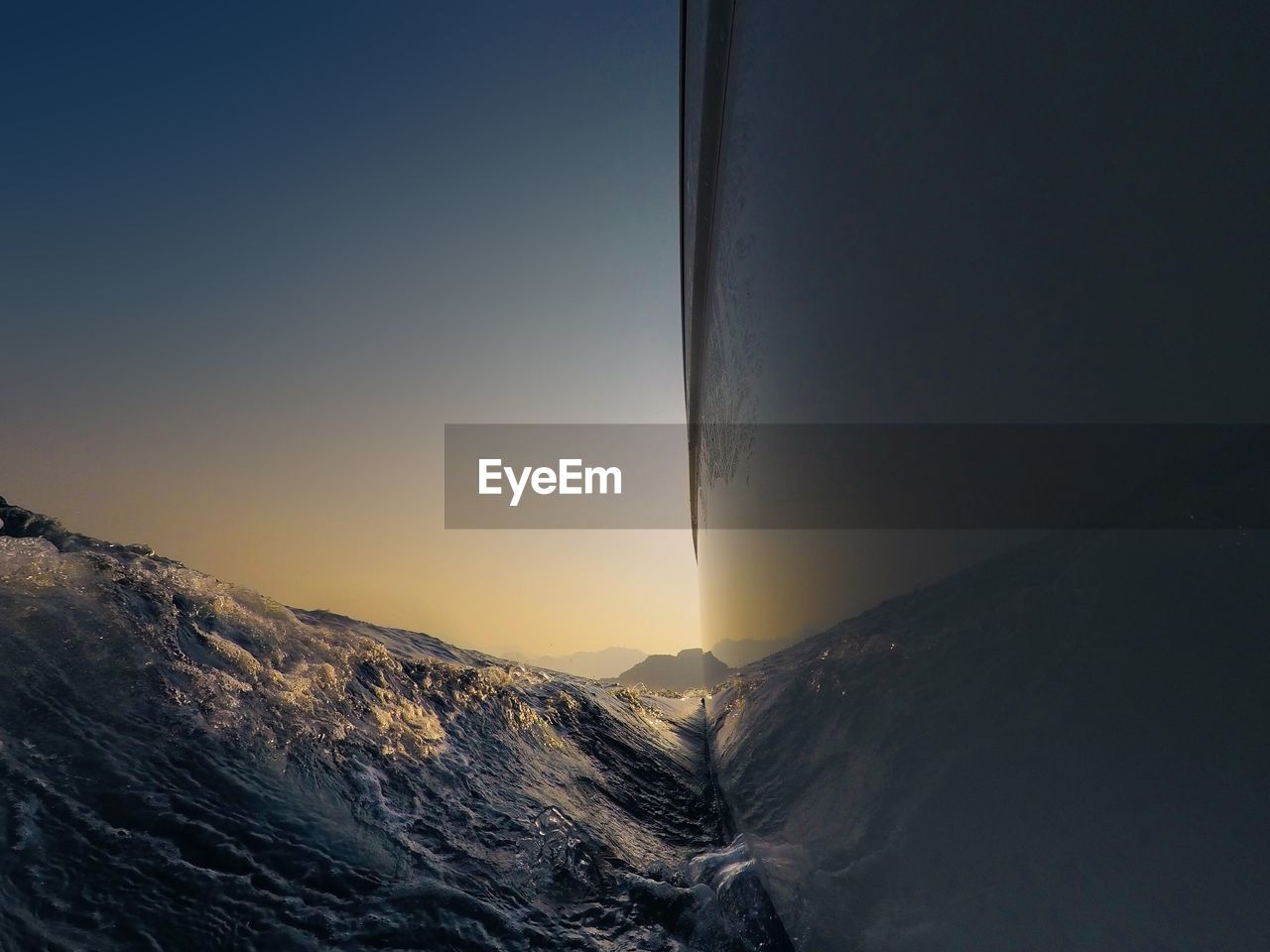 Close-up of mountains against clear sky during sunset