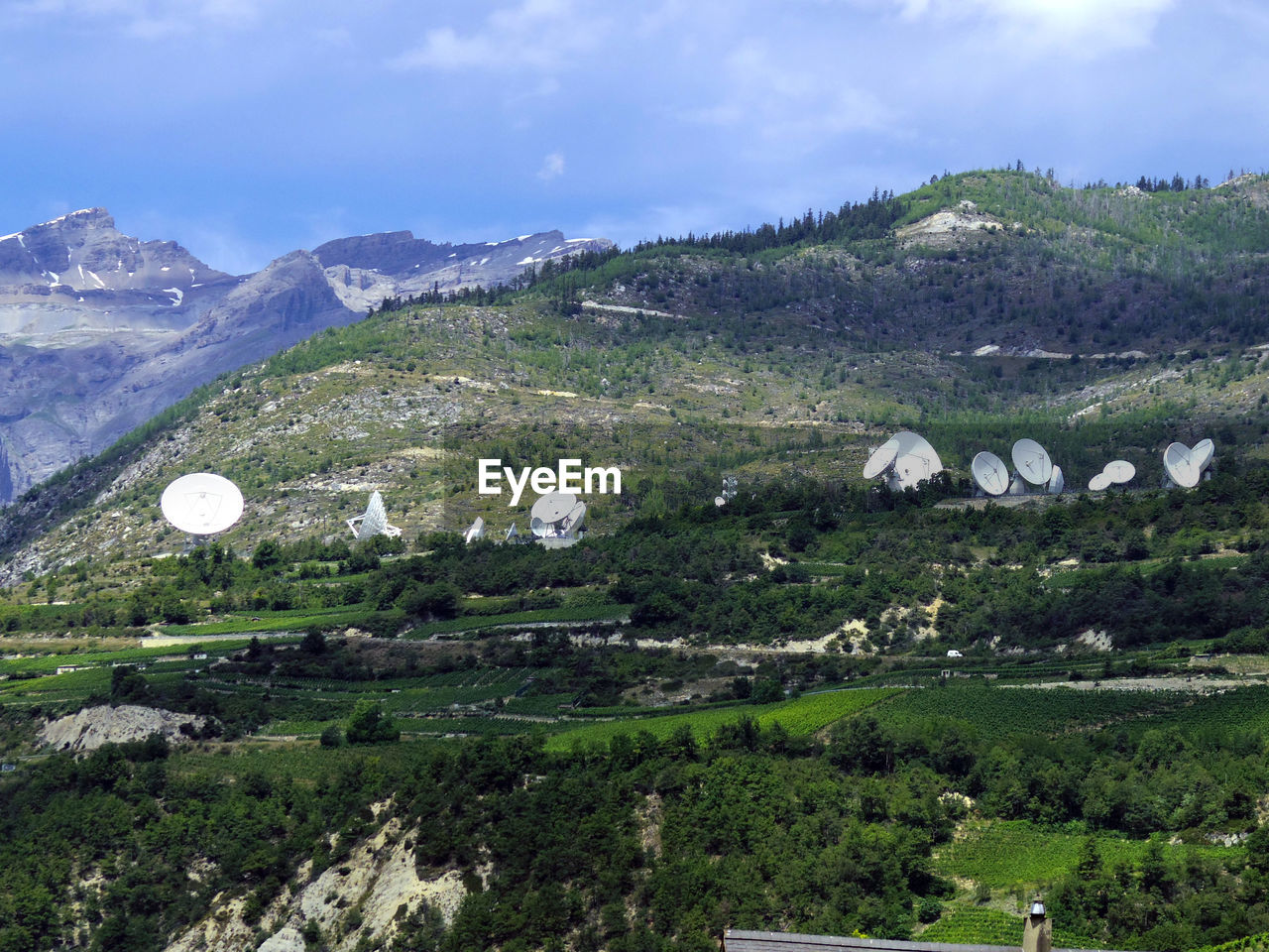 Satterlite dishes oon mountainscape in europe communication technologies
