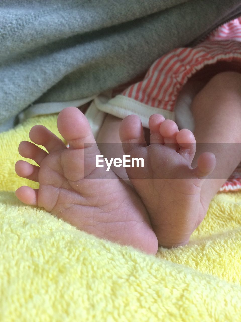 LOW SECTION OF BABY FEET