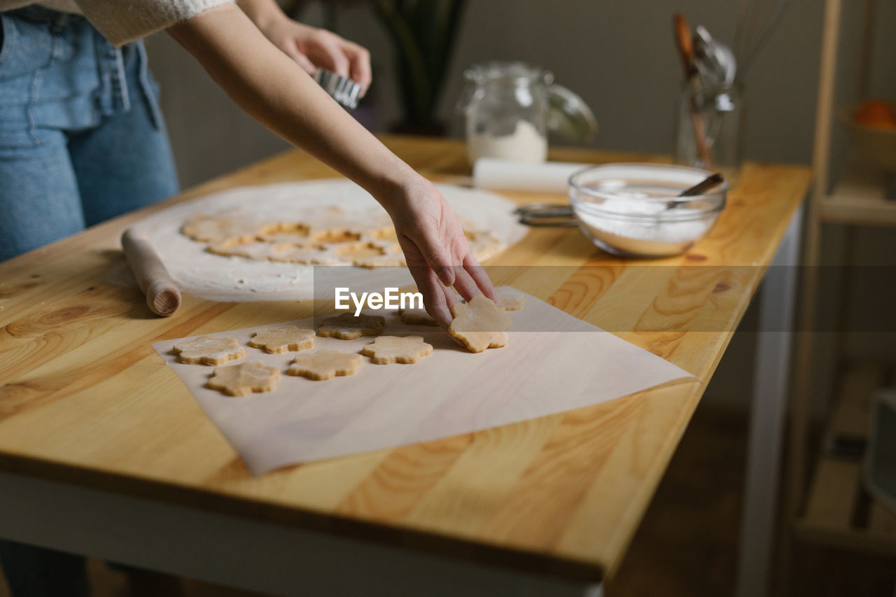 Young woman making christmas cookies