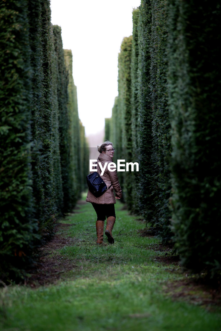 Rear view of woman walking in park