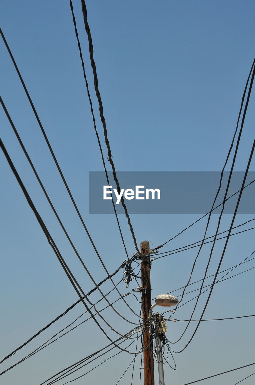 LOW ANGLE VIEW OF ELECTRICITY PYLON AGAINST SKY