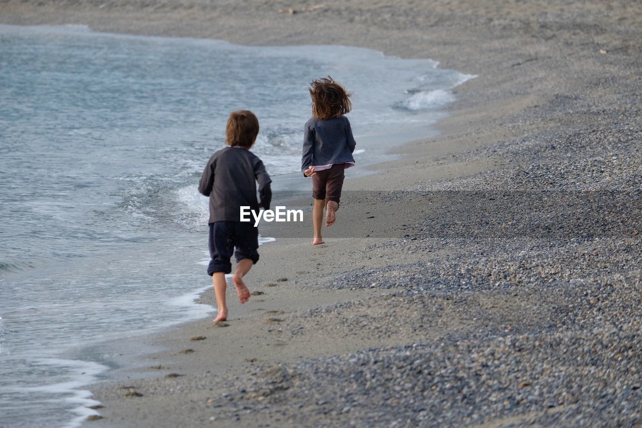 Children running on beach