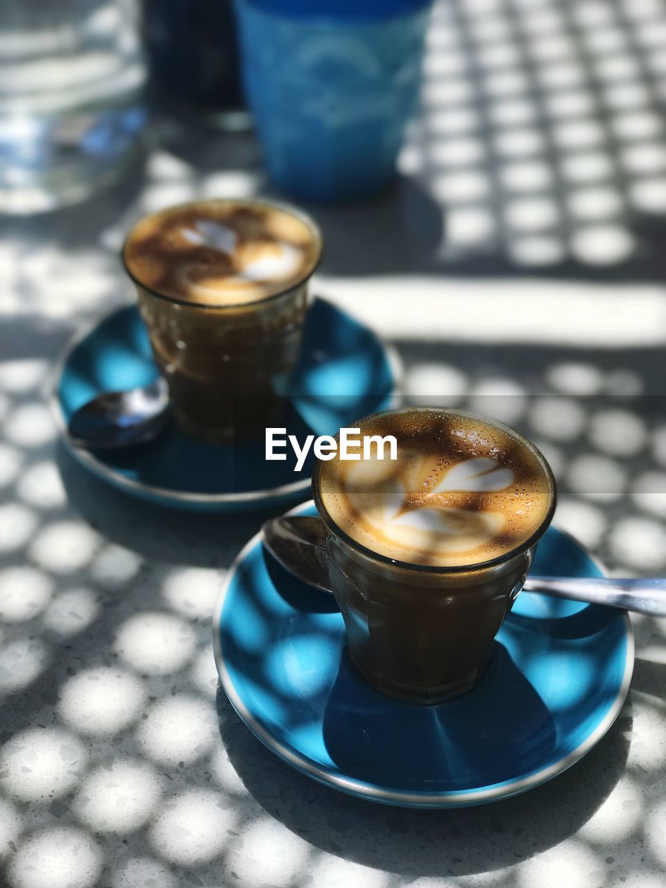 High angle view of coffee cups on table