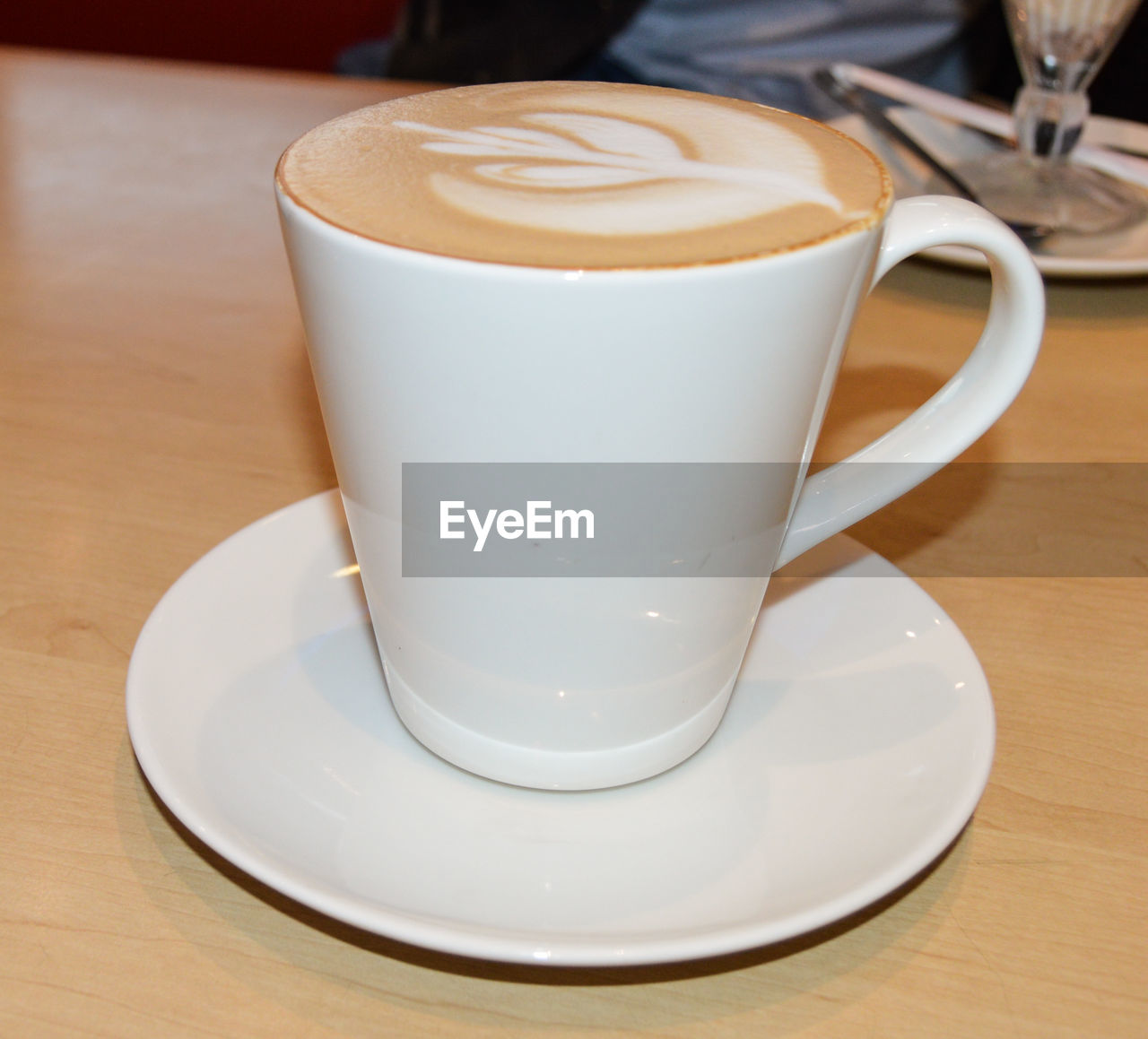 COFFEE CUP ON TABLE