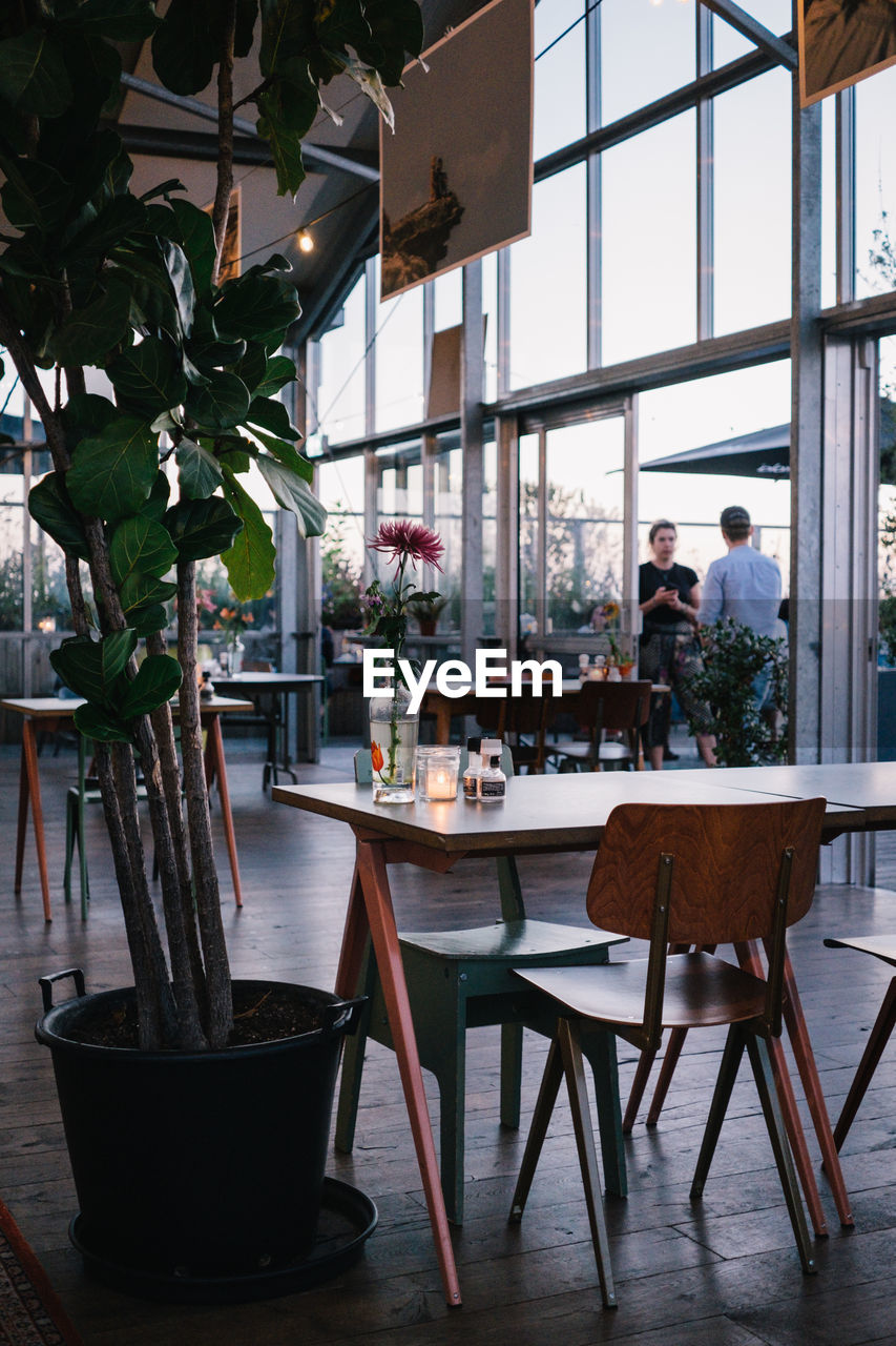 CHAIRS AND TABLE IN RESTAURANT