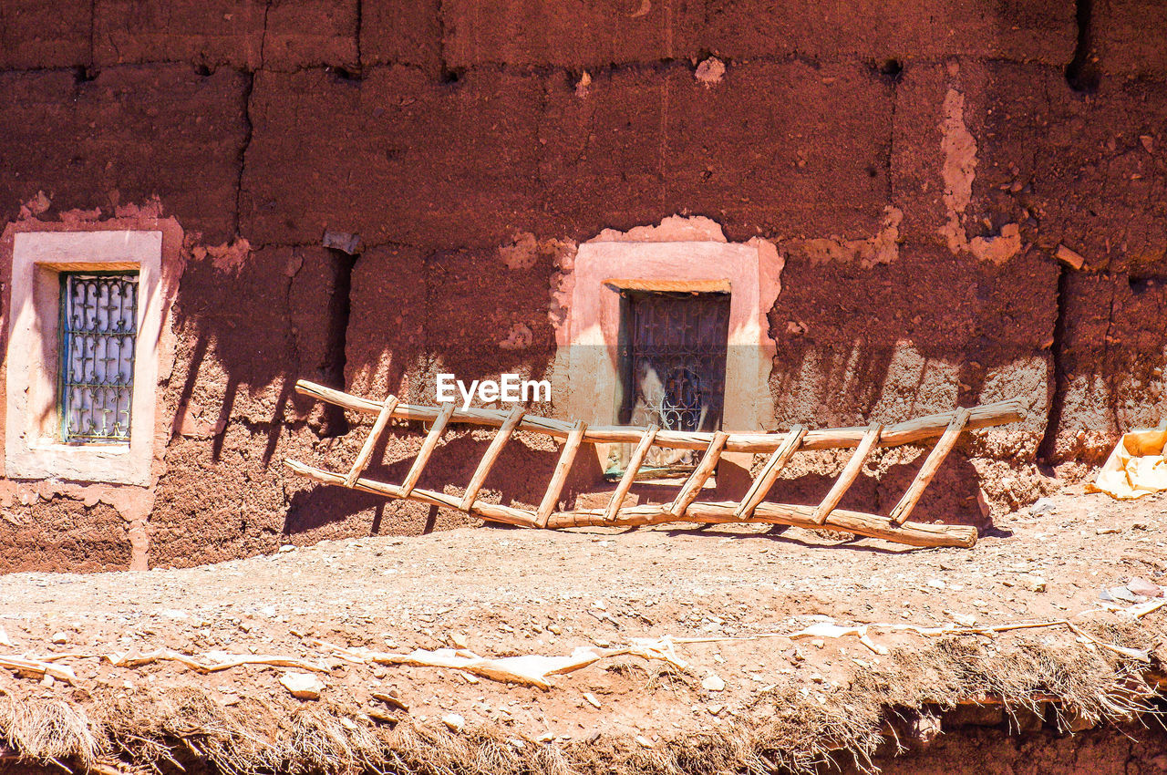 OLD WEATHERED WALL OF BUILDING