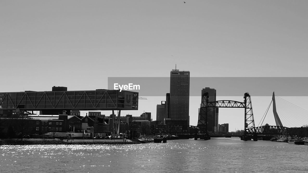 CITY BY RIVER AGAINST SKY