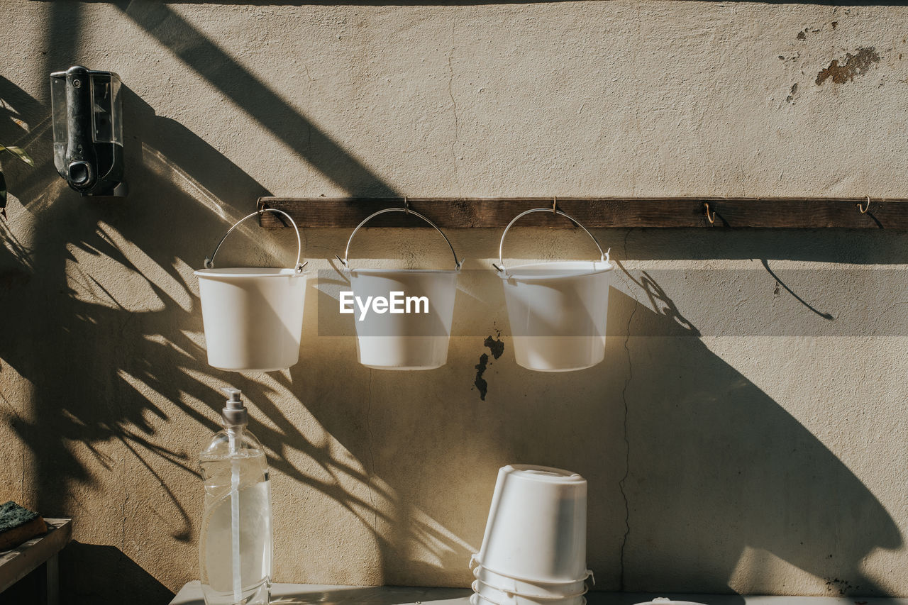 Buckets hanging against wall