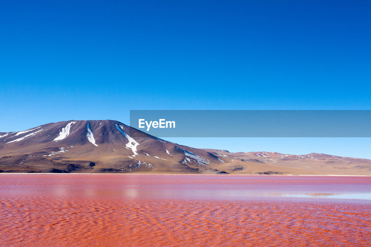 SCENIC VIEW OF SNOWCAPPED MOUNTAINS AGAINST CLEAR BLUE SKY