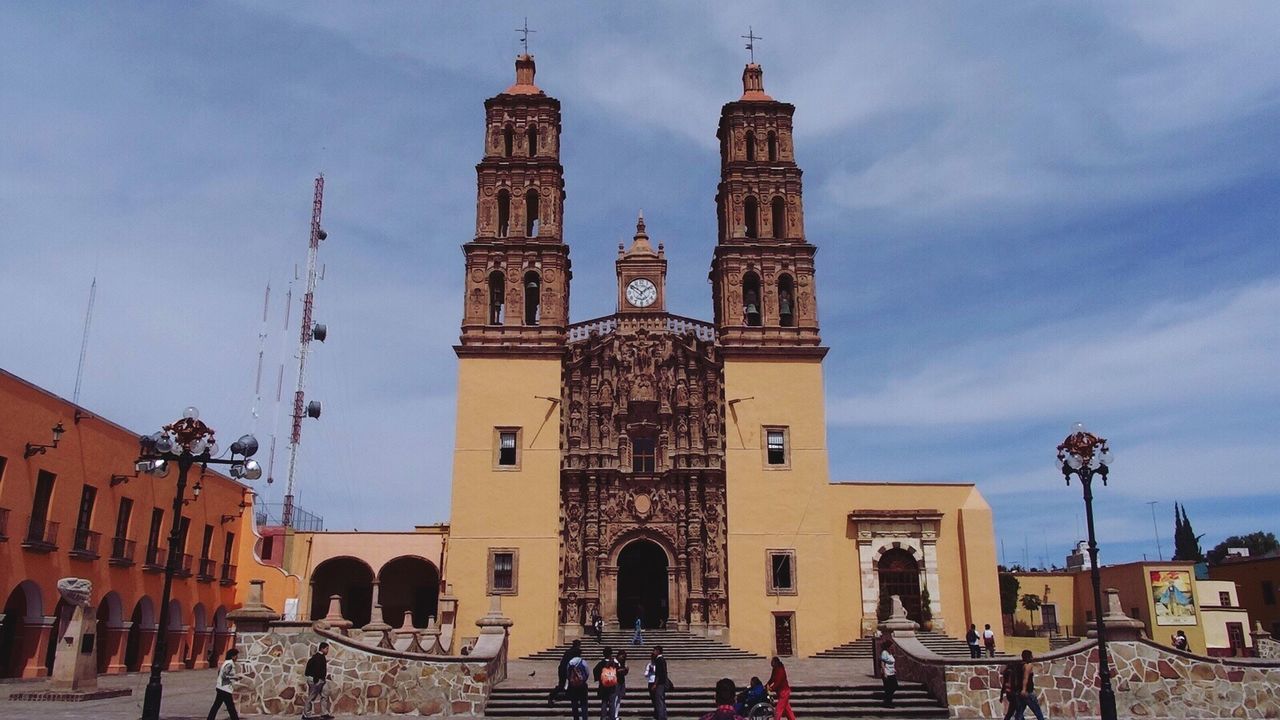 Low angle view of cathedral against cloudy sky