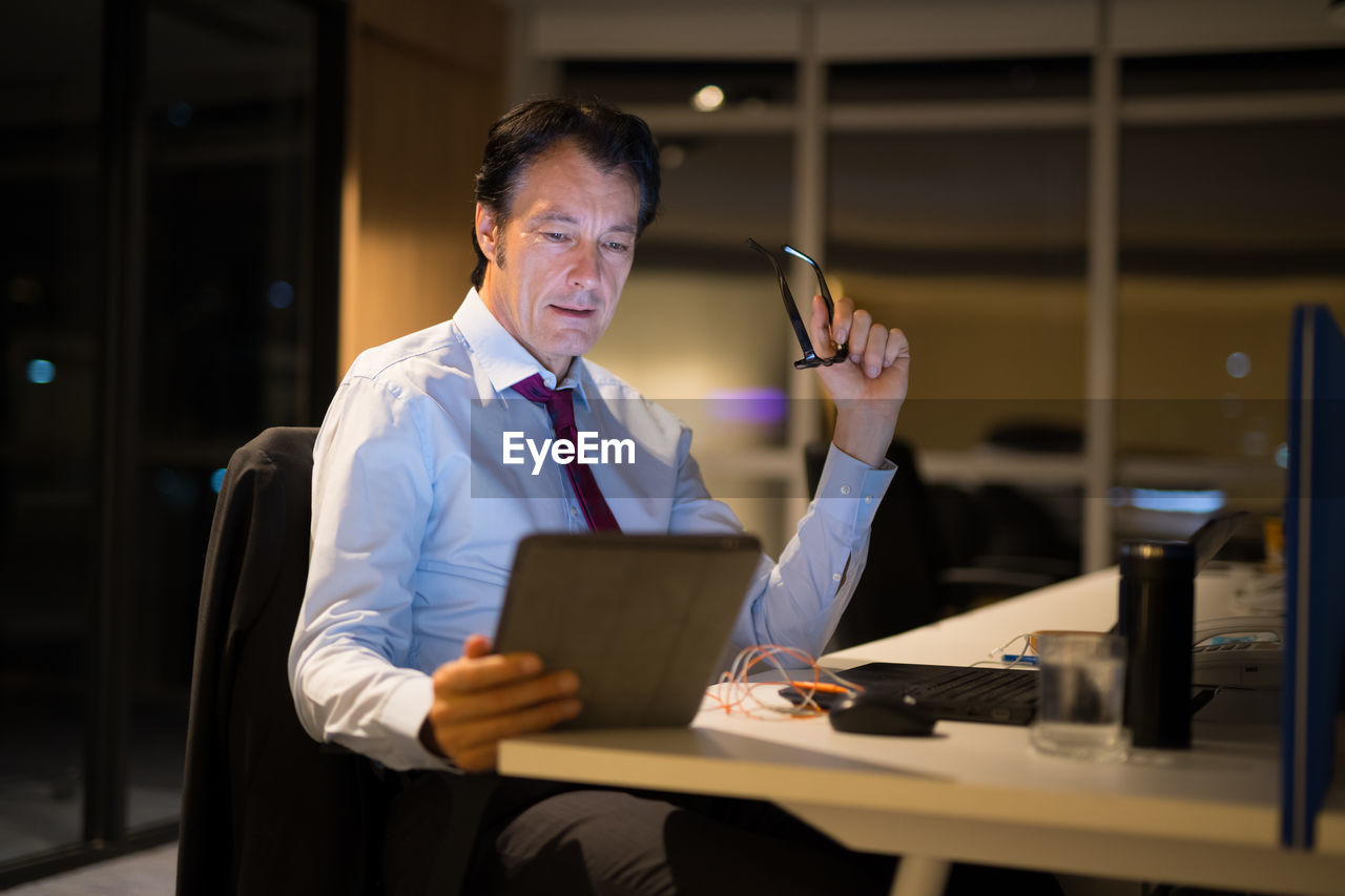 Businessman holding digital tablet at office