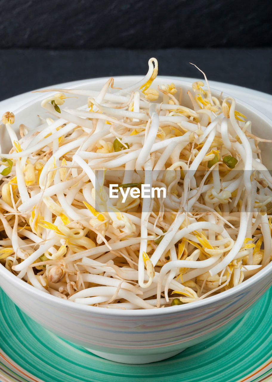 Plate of bean sprouts of black slate tray. top view food photography.