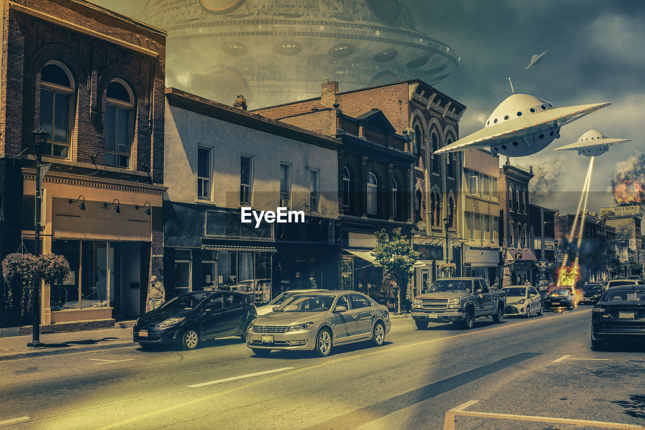 Digital composite image of ufo attacking buildings and cars on in city