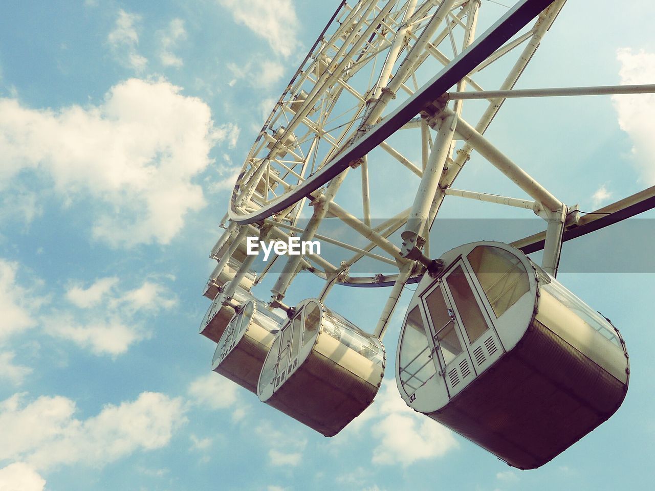 LOW ANGLE VIEW OF ROLLERCOASTER AGAINST SKY