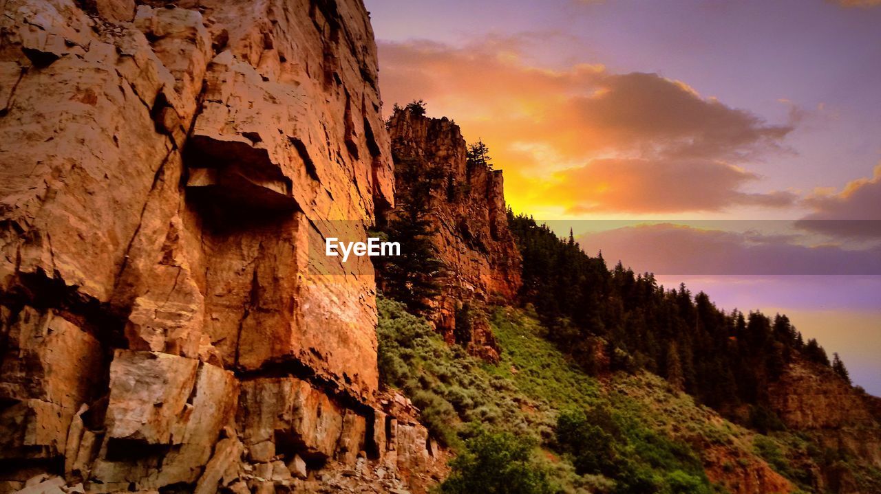 LOW ANGLE VIEW OF ROCK FORMATION AGAINST SKY