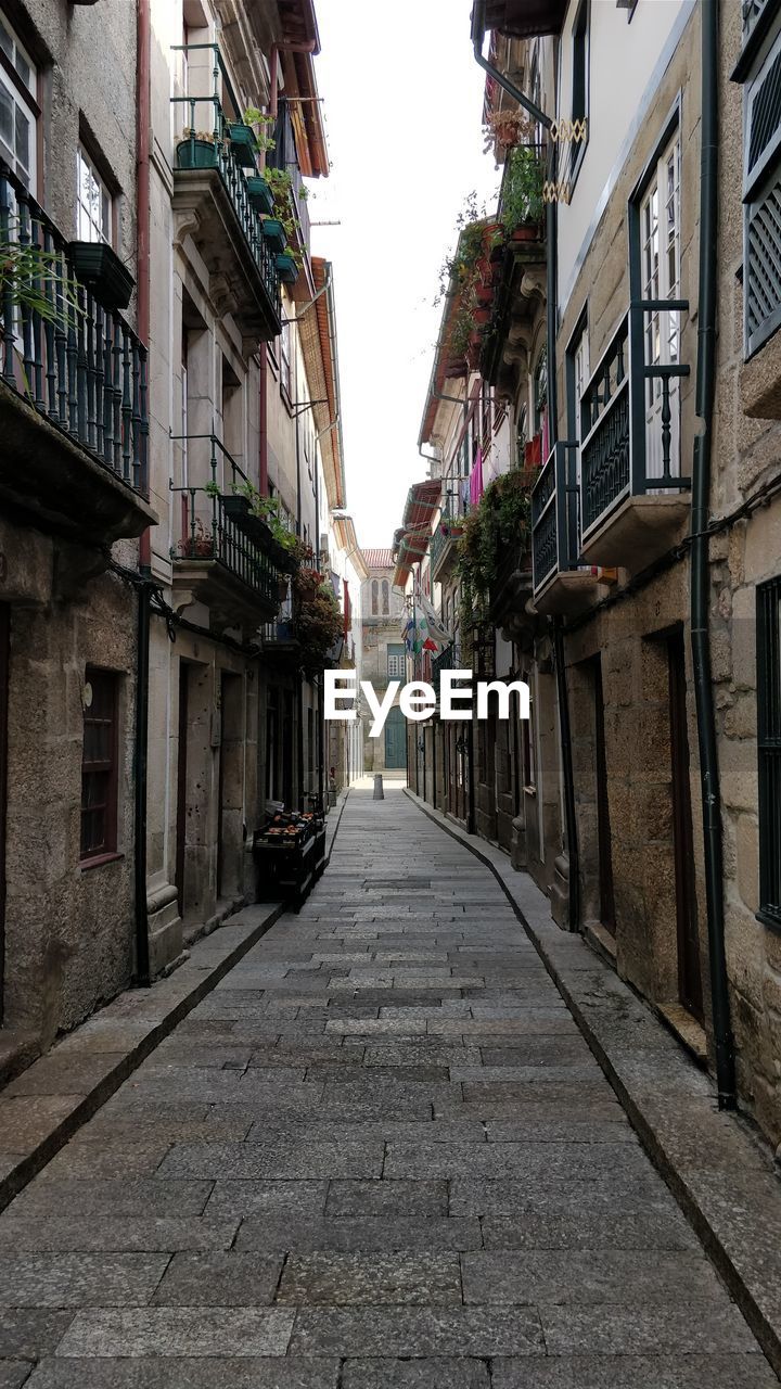 Narrow alley amidst residential buildings