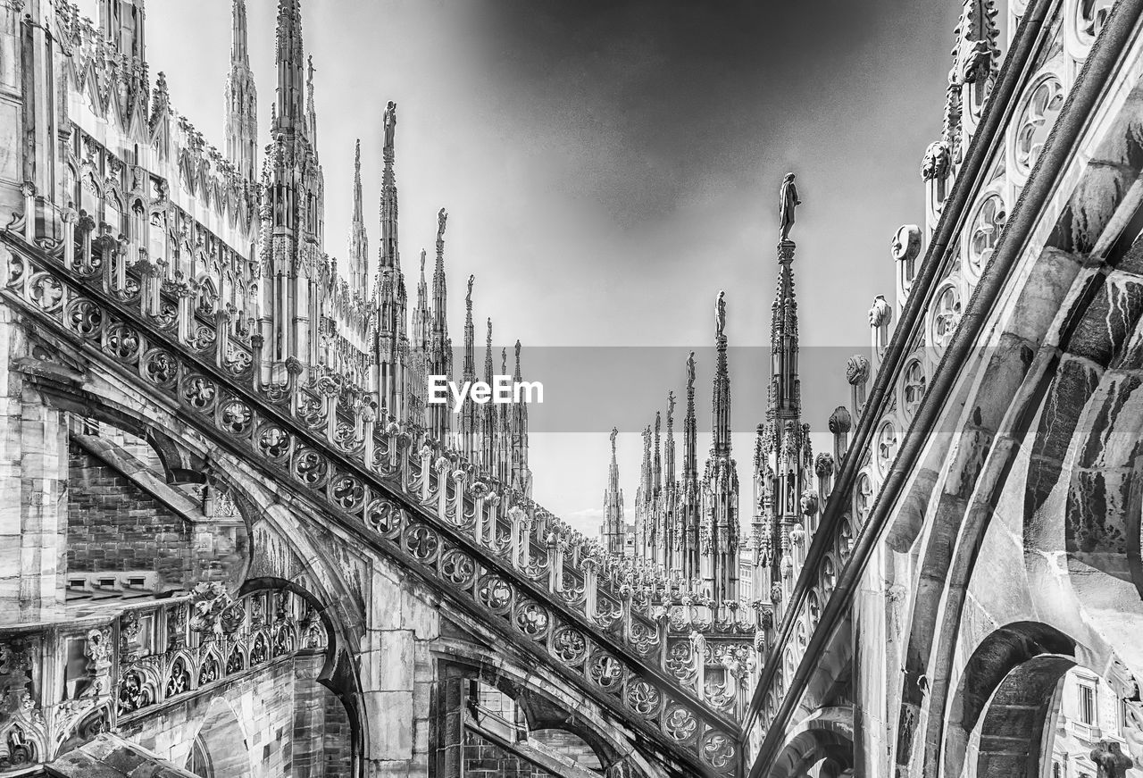 architecture, black and white, built structure, cityscape, building exterior, monochrome photography, metropolis, monochrome, sky, city, travel destinations, landmark, cloud, nature, building, urban area, history, skyscraper, no people, travel, low angle view, the past, outdoors, worship, tourism, bridge, day, tower, panoramic