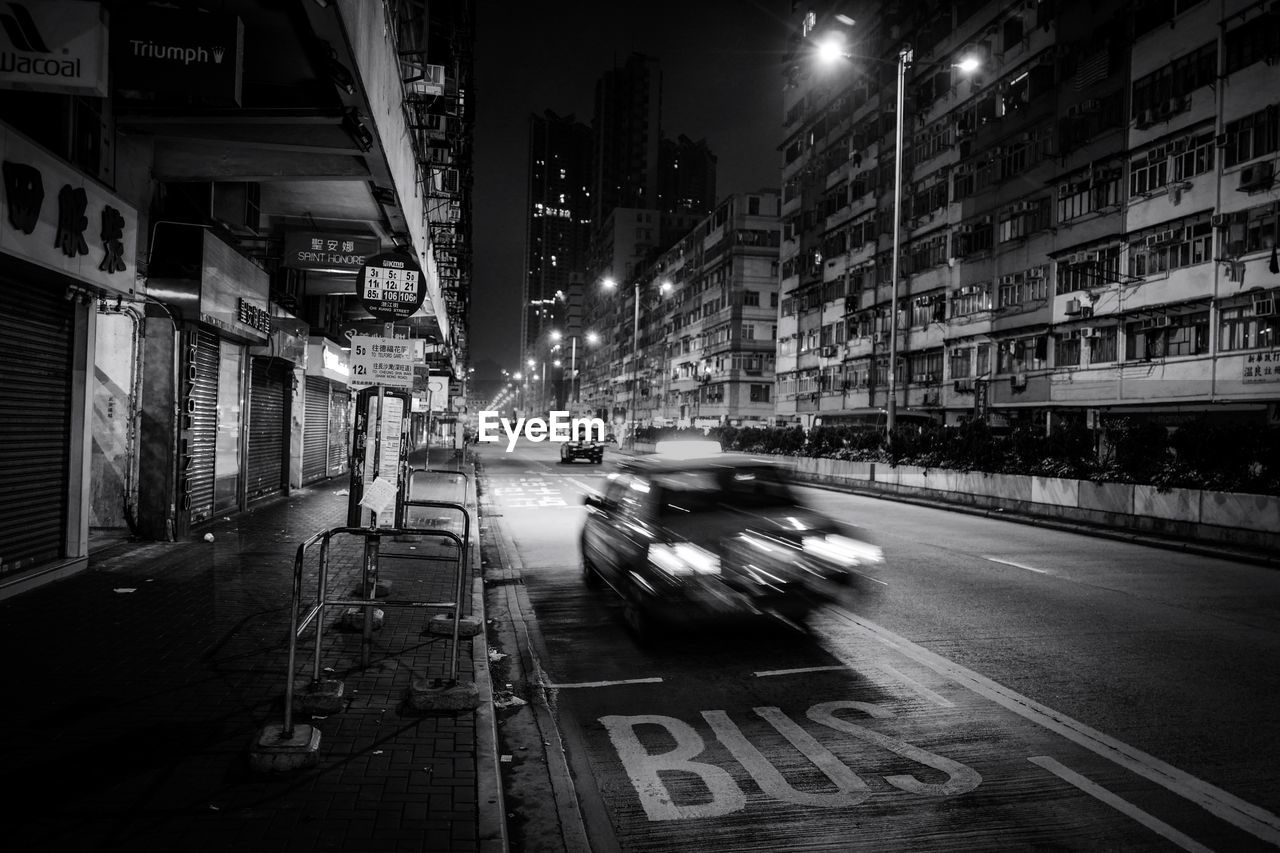 Cars on city street at night