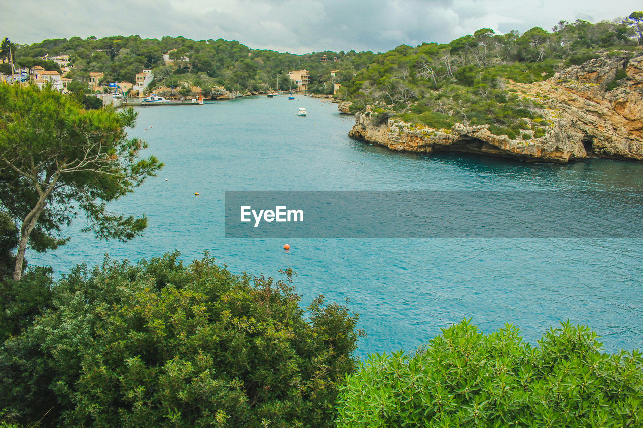 Scenic view of bay against sky