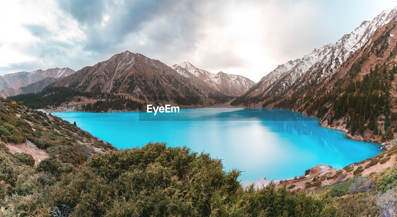 Lake and mountains against sky