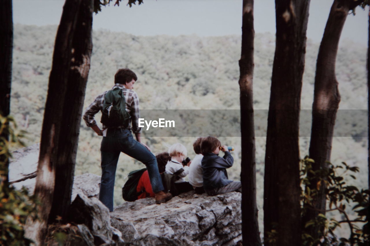 Man and children at cliff