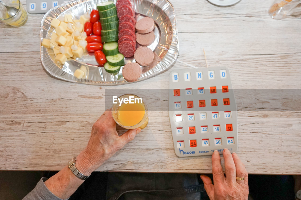 High angle view of man preparing food on table