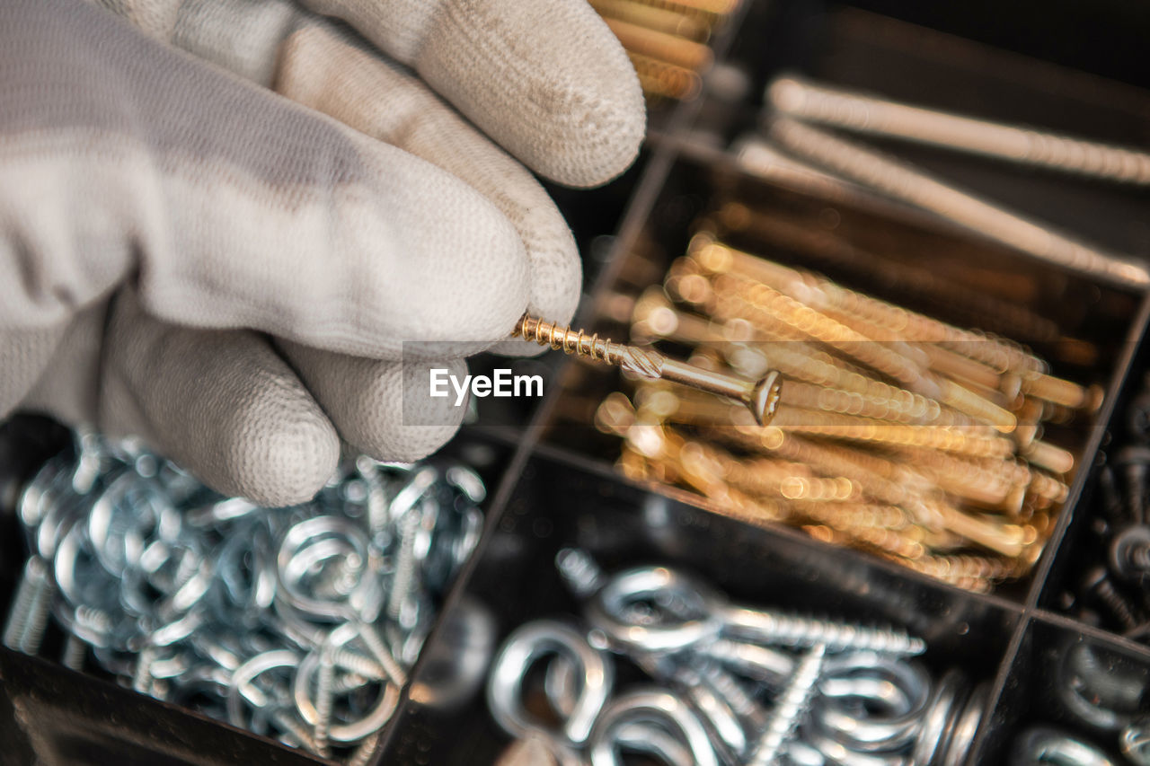 cropped hand of man working in workshop