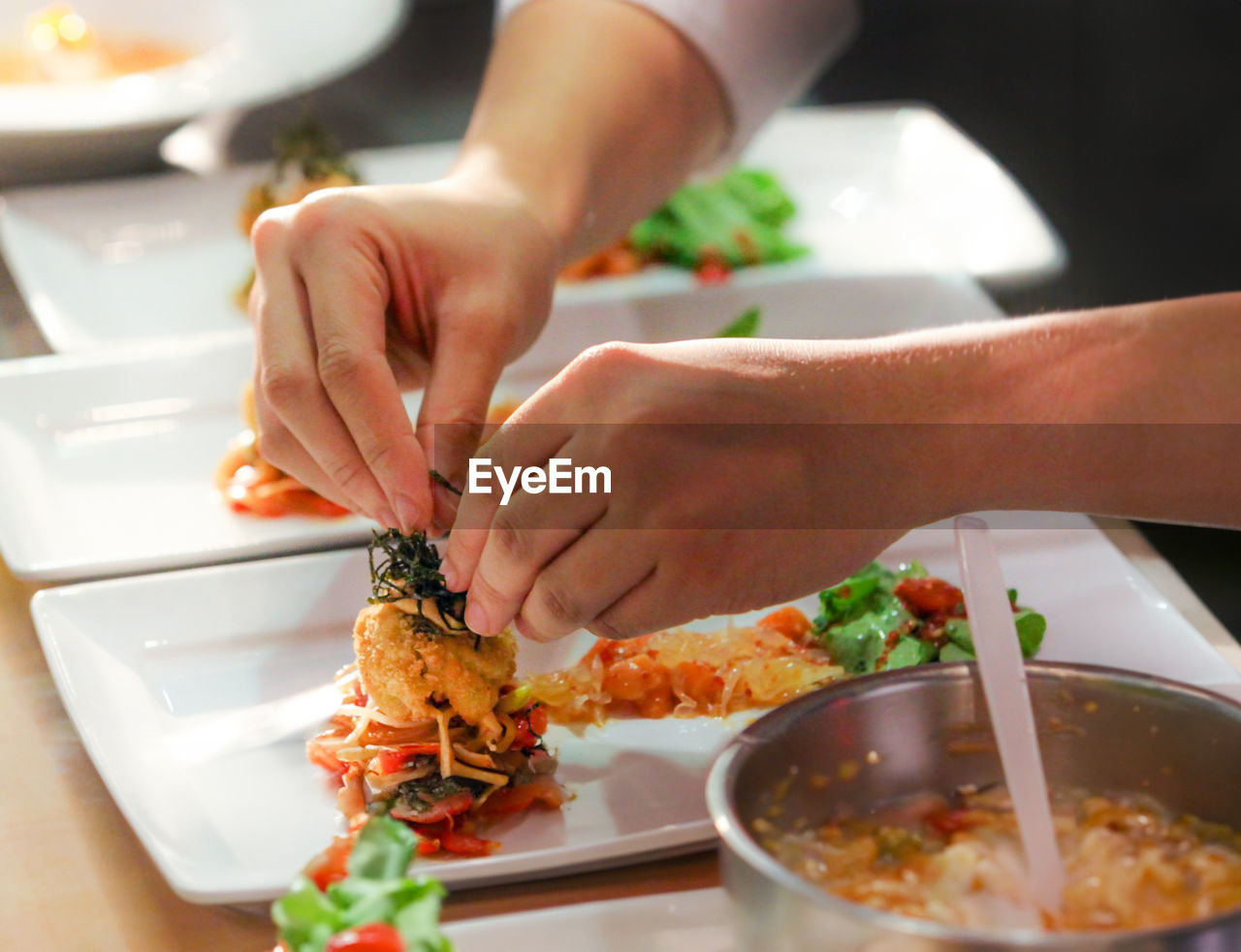 cropped hands of woman preparing food