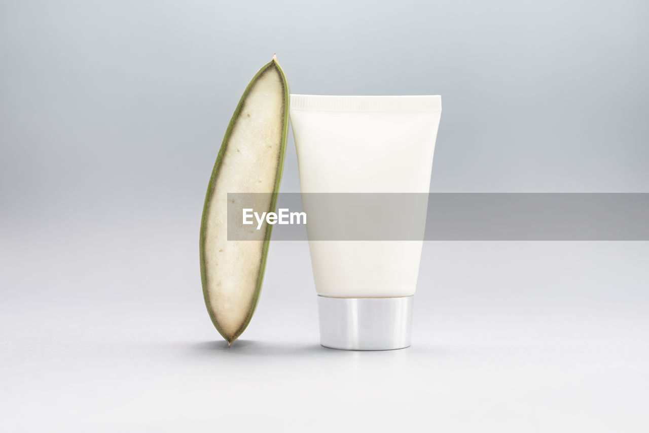 close-up of drink on table against white background