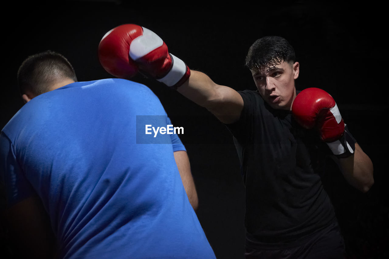 Two boxers training on a ring