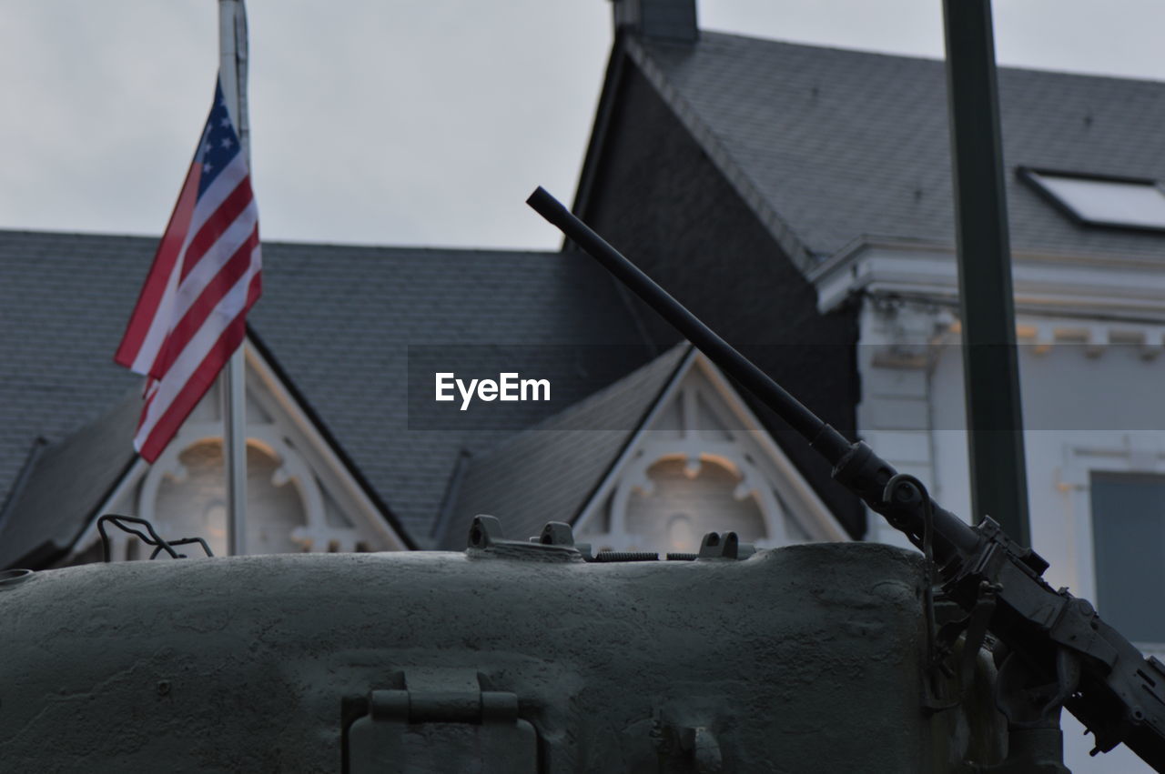 CLOSE-UP OF FLAGS AGAINST THE SKY