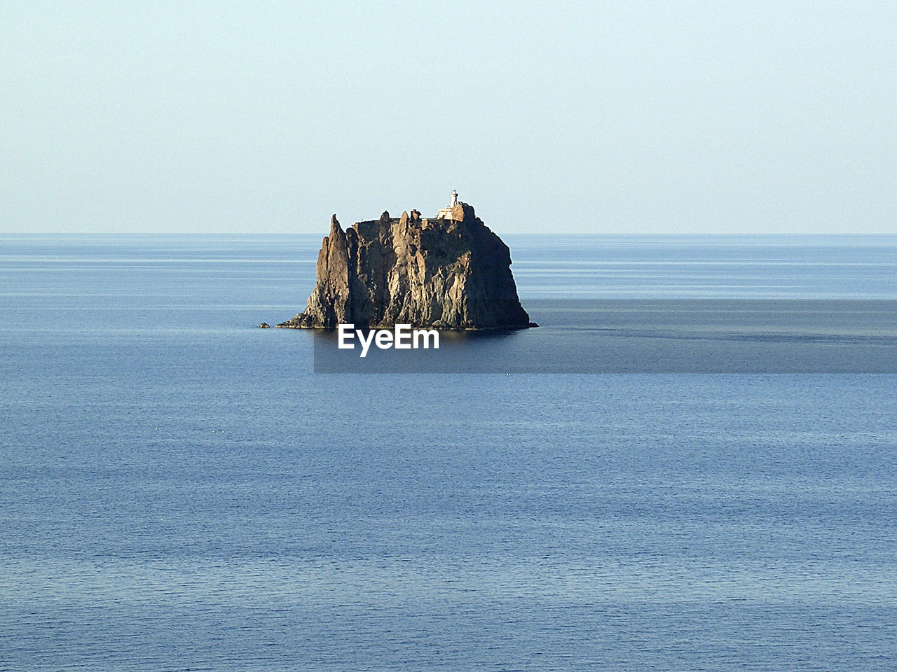 Scenic view of calm sea against blue sky