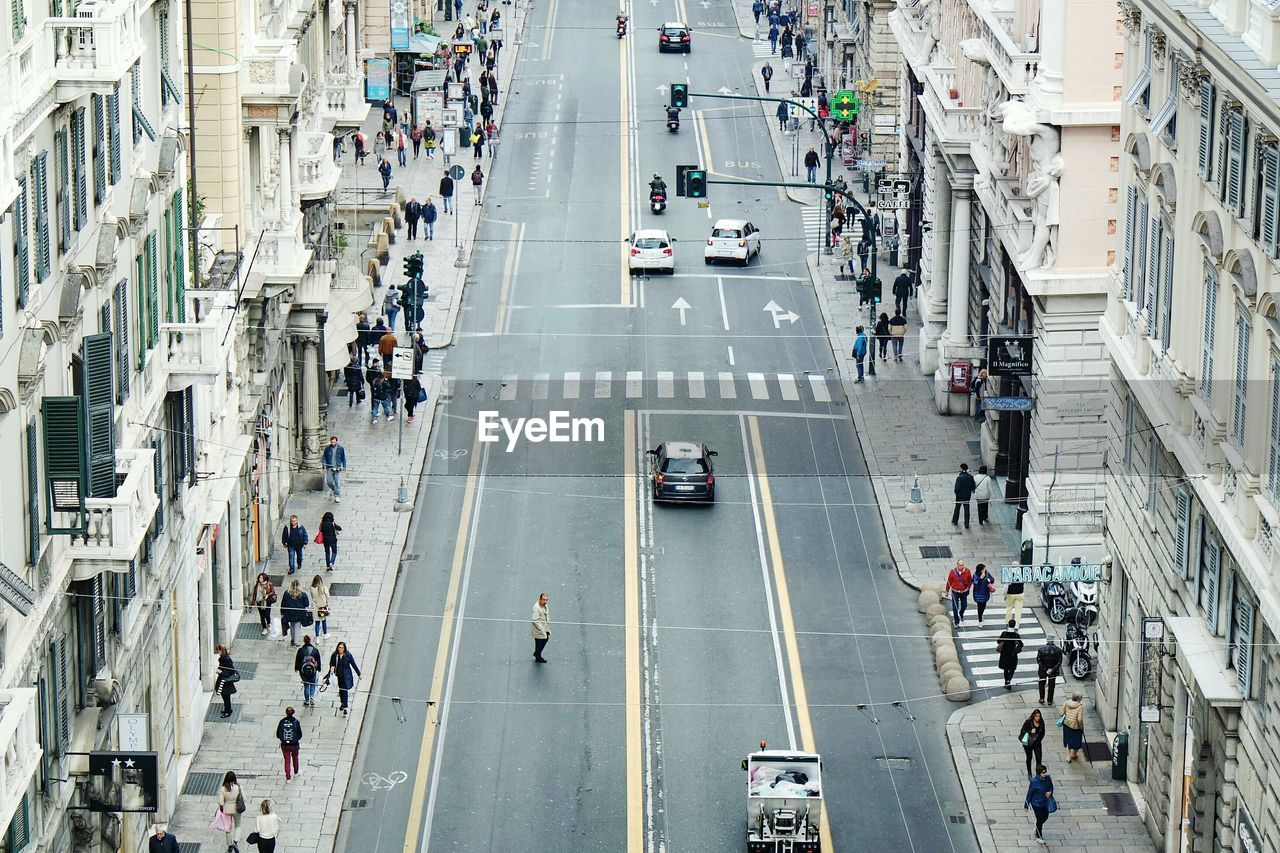 High angle view of people walking on road