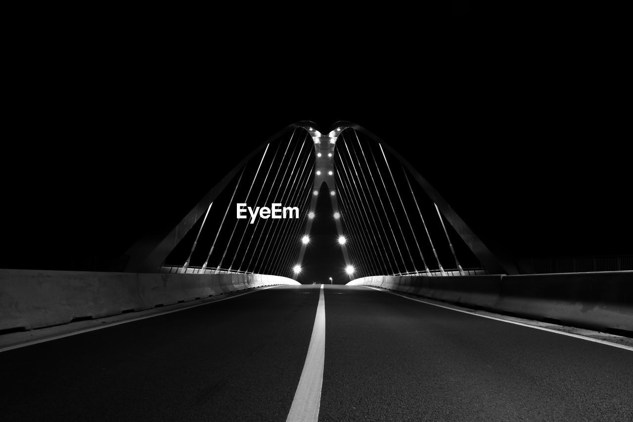 Illuminated road bridge at night