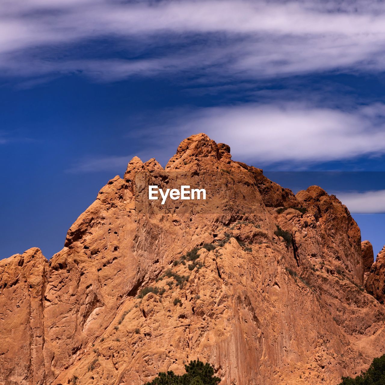 sky, rock, landscape, scenics - nature, environment, nature, beauty in nature, mountain, cloud, land, rock formation, travel destinations, travel, desert, non-urban scene, no people, semi-arid, wilderness, outdoors, plant, tranquility, geology, mountain range, plateau, natural environment, valley, climate, blue, tourism, tranquil scene, extreme terrain, dramatic sky, sunset, remote, tree, sunlight, idyllic, arid climate, animal wildlife