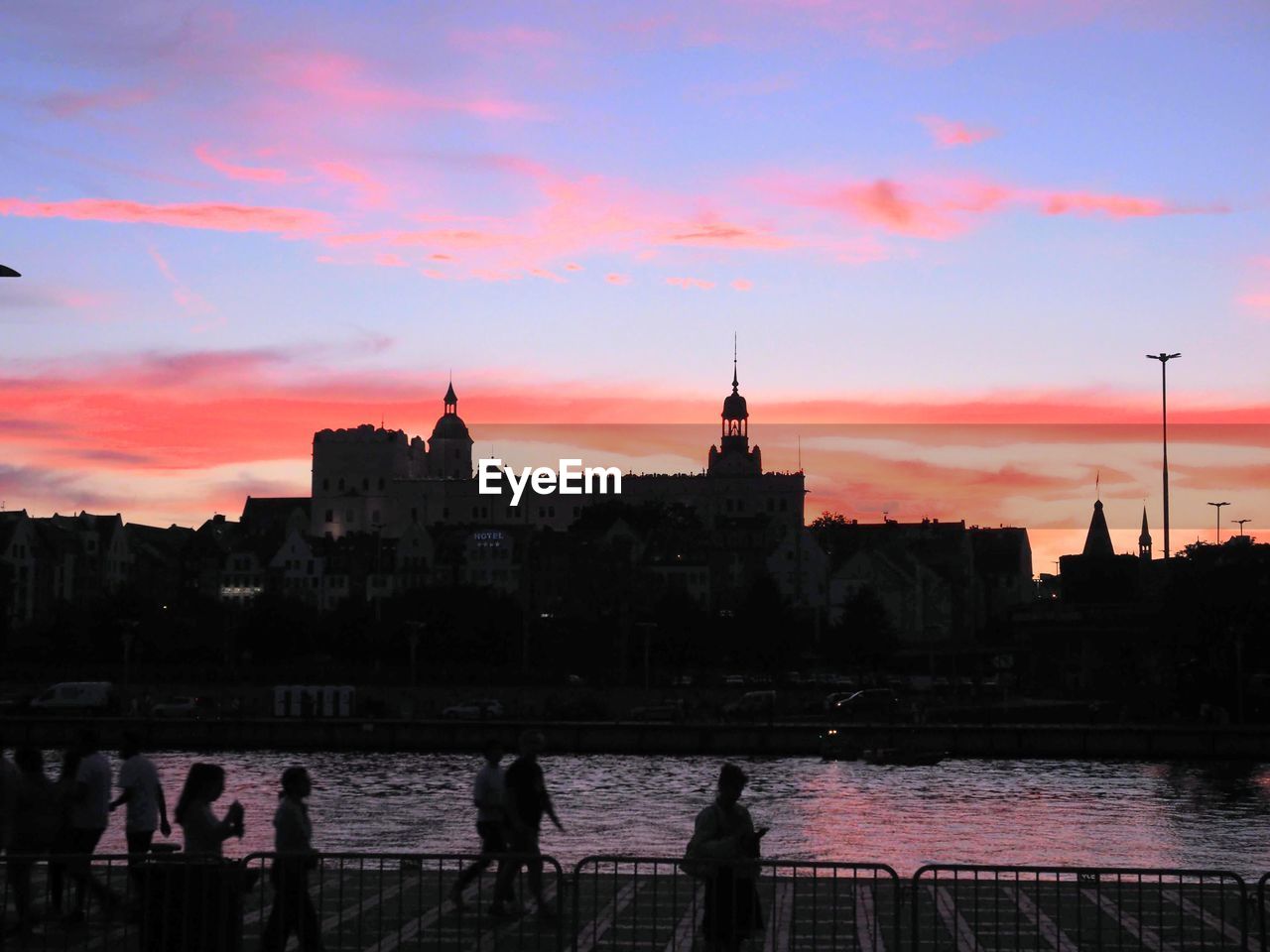 Scenic view of river and castle against sky during sunset