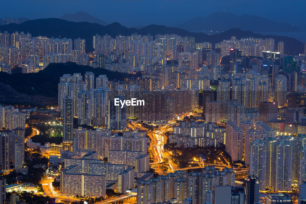 Aerial view of buildings in city at night