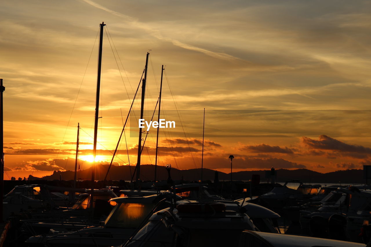 SAILBOATS IN MARINA DURING SUNSET