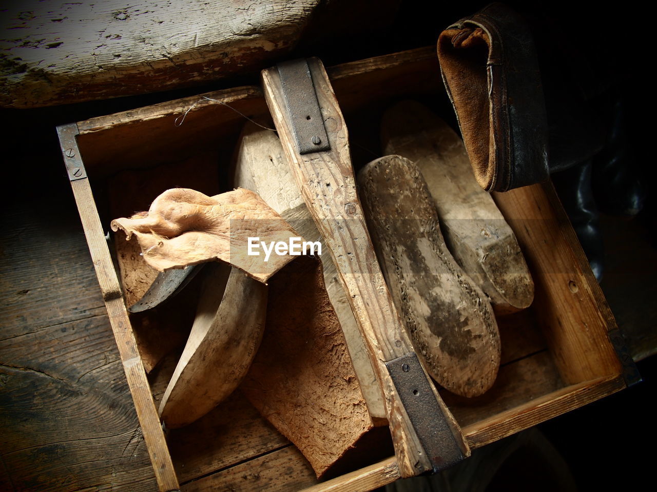 Close-up of objects in wooden box