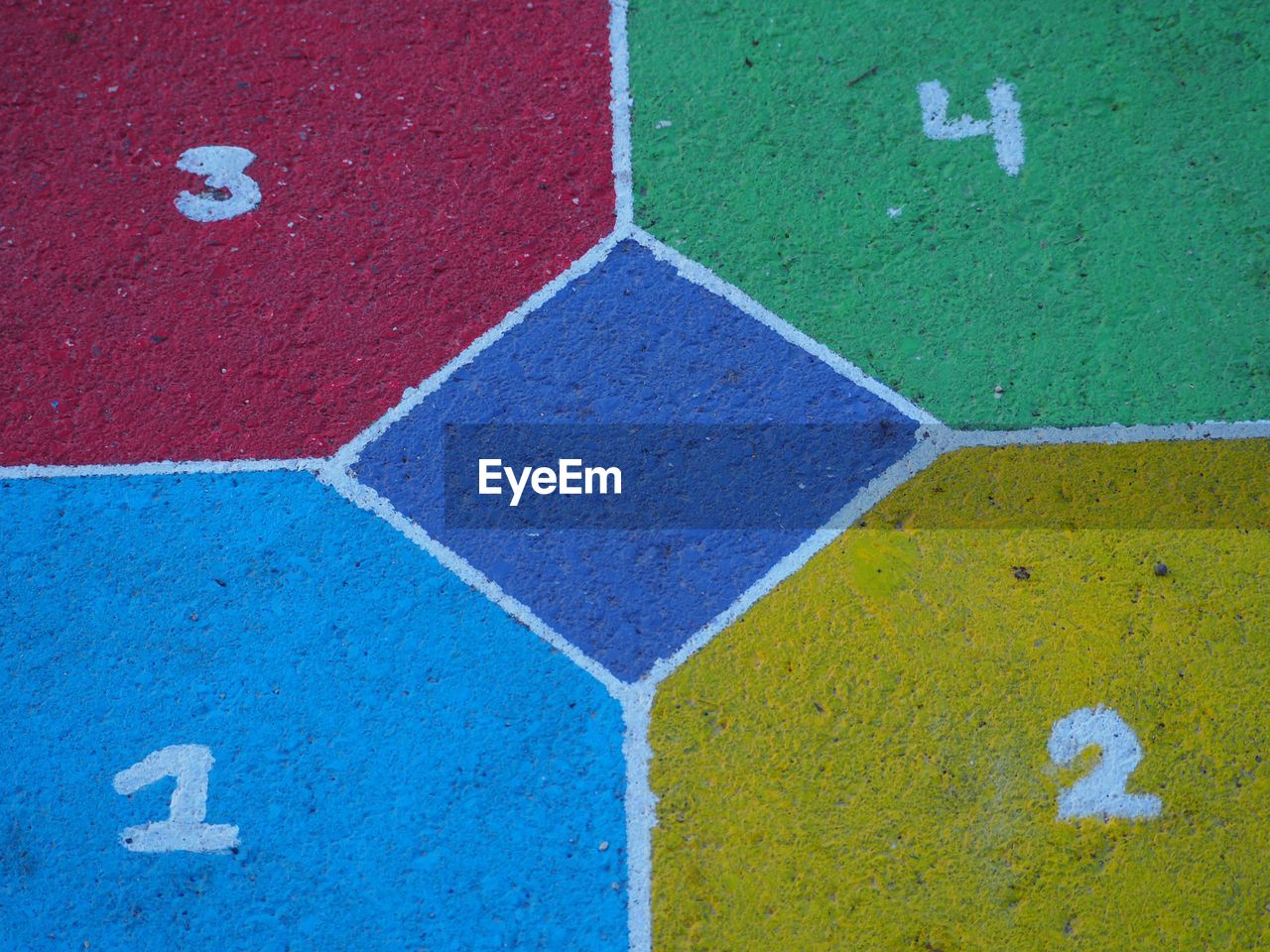 FULL FRAME SHOT OF MULTI COLORED WALL WITH UMBRELLA