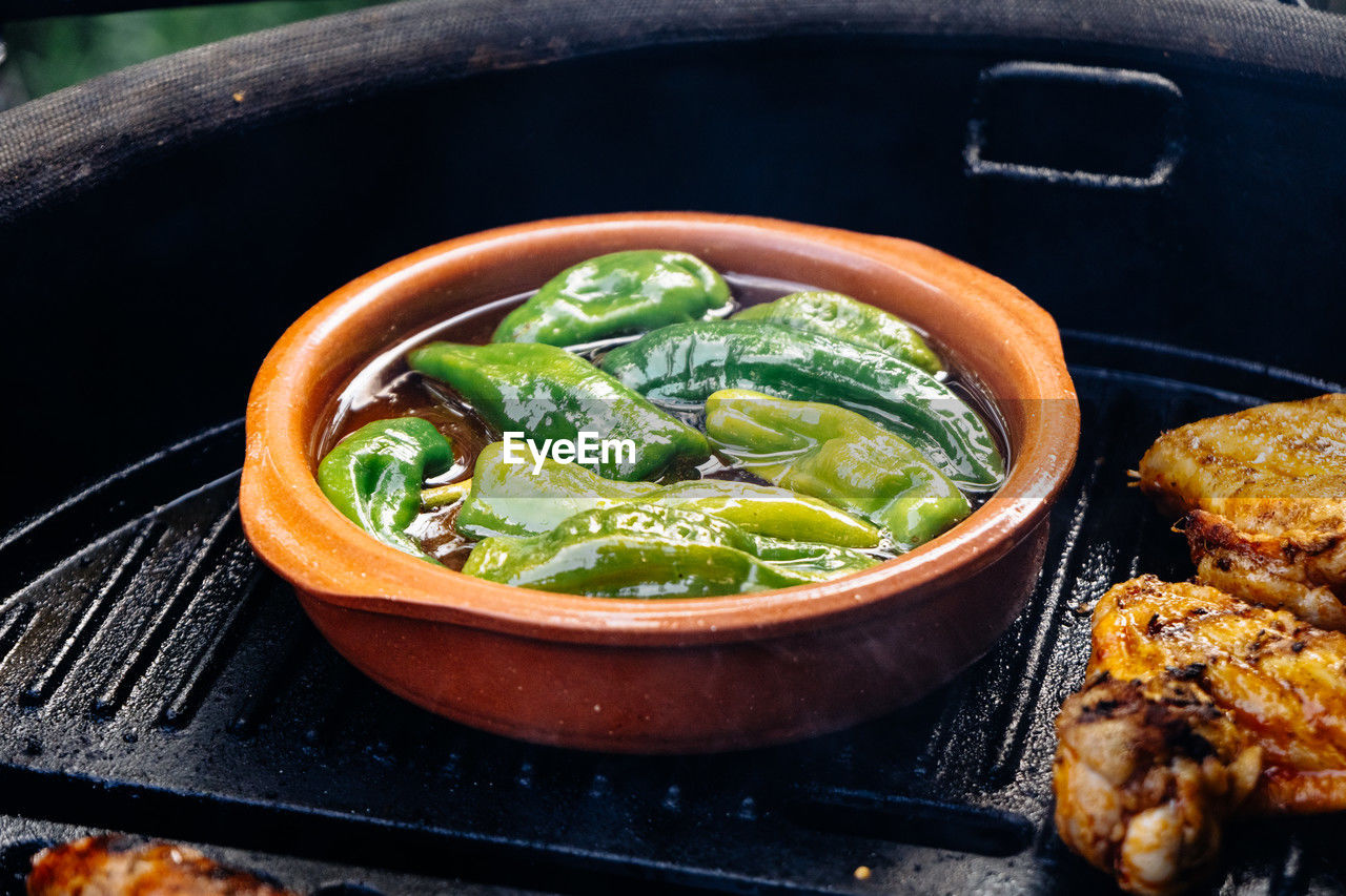 food and drink, food, healthy eating, vegetable, freshness, dish, wellbeing, no people, cuisine, meat, produce, fast food, meal, high angle view, indoors, heat, bowl, kitchen utensil